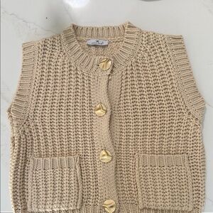 Elegant Cream Knit Sleeveless Cardigan with Gold Accents